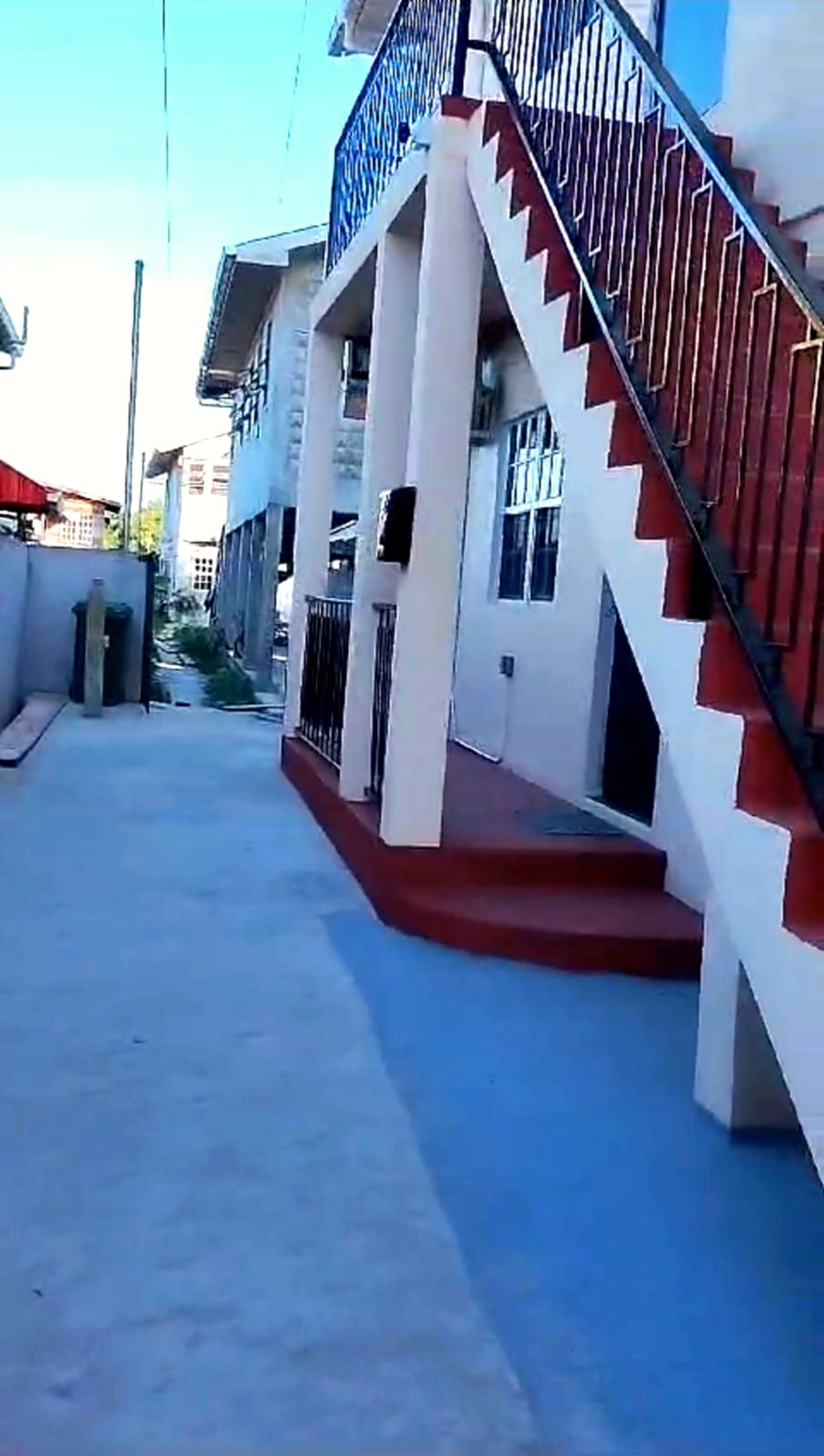 Property side view and stairs